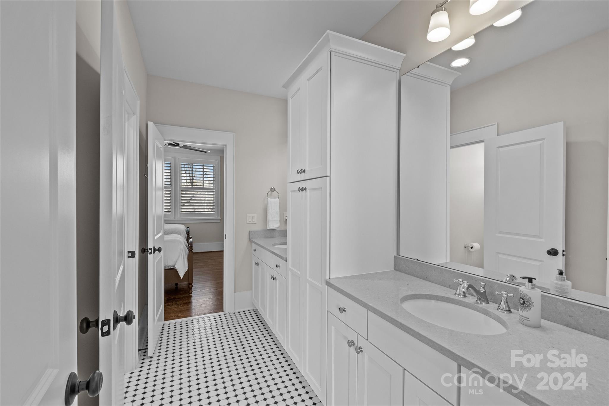5629 Closeburn Road Charlotte, NC 28210 - Photo 34 of 44 a bathroom with a shower sink and mirror