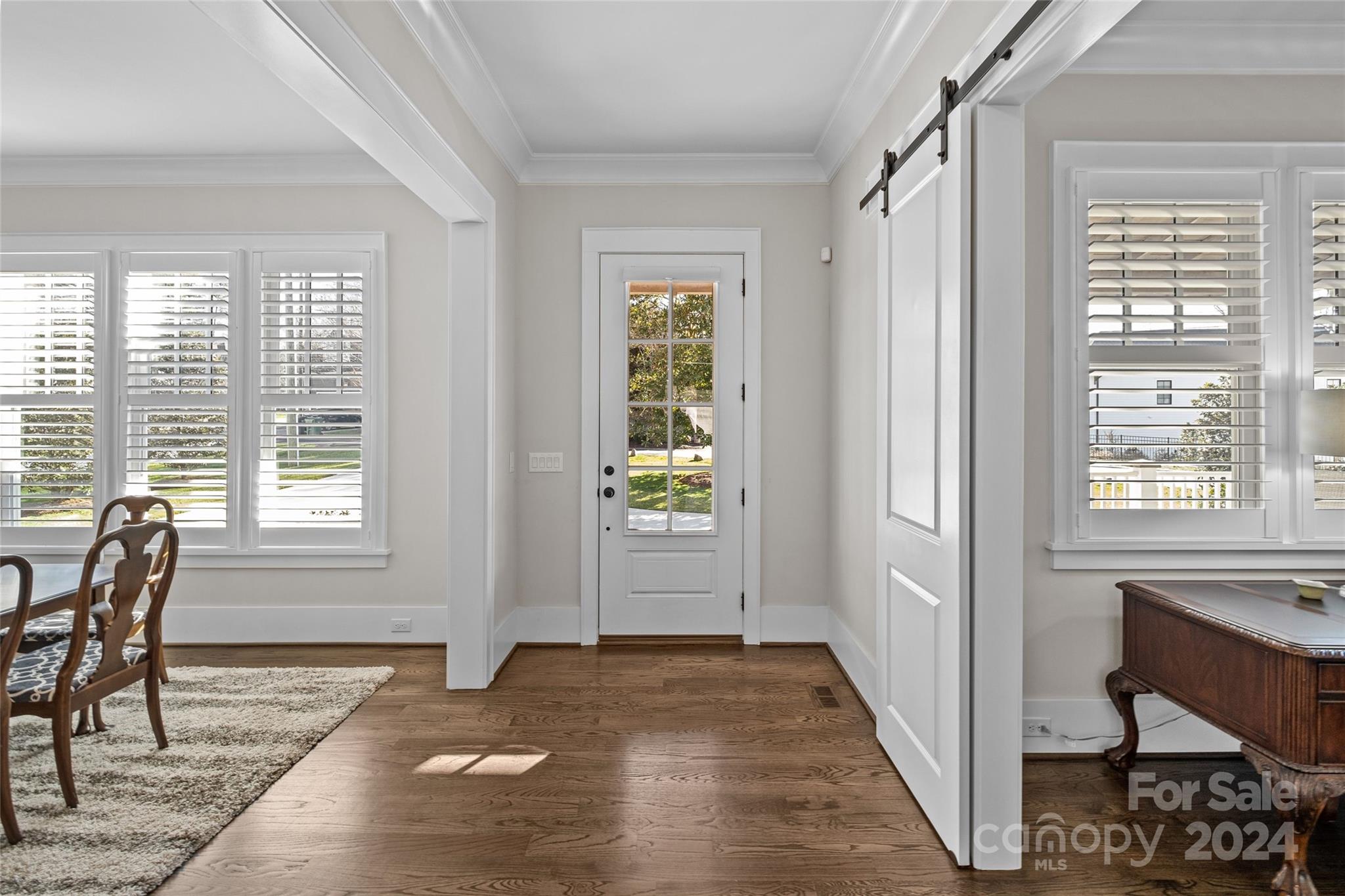 5629 Closeburn Road Charlotte, NC 28210 - Photo 8 of 44 a view of a livingroom with wooden floor and windows
