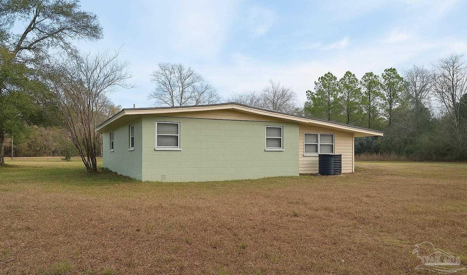 6274 Munson Highway Milton, FL 32570 - Photo 3 of 26 a view of a house with a backyard