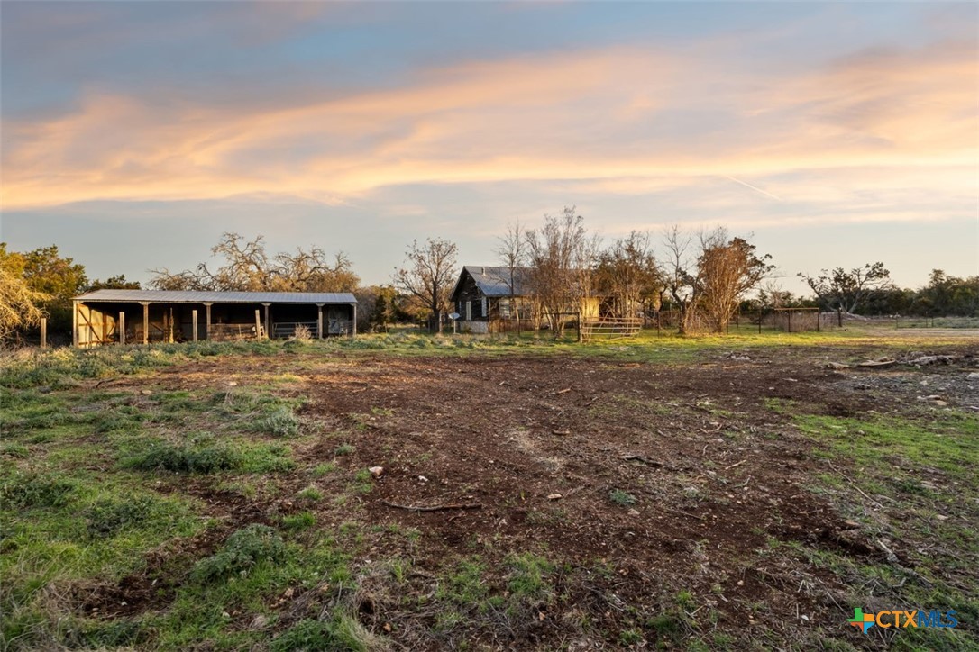 3003 Old Red Ranch Road Johnson City, TX 78636 - Photo 17 of 17 a view of a big yard with some trees