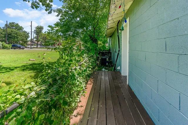 a view of a balcony with wooden floor