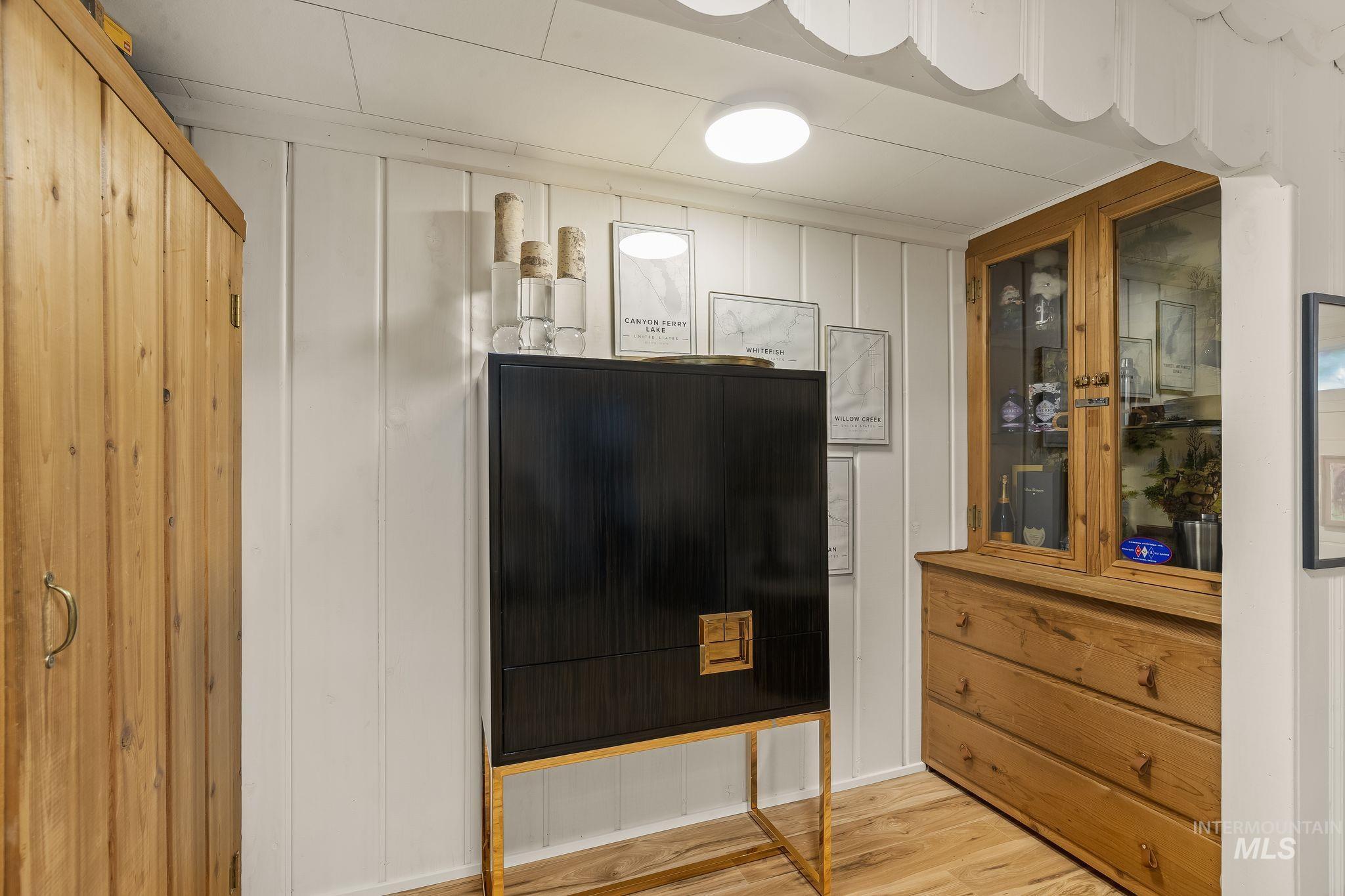 1315 8th Street Clarkston, WA 99403 - Photo 26 of 37 Natural wood-finish flooring complements white vertical paneling