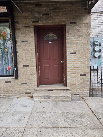 a front view of a house with stairs