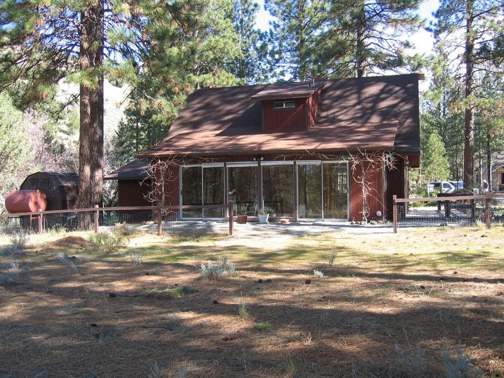 17525 Marmot Road Weed, CA 96094 - Photo 3 of 3 a view of a house with a tree in a yard