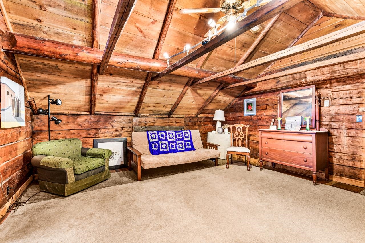 3723 Birchwood Road Kettle River, MN 55757 - Photo 8 of 48 Sitting room featuring wooden ceiling, wood walls, and carpet floors
