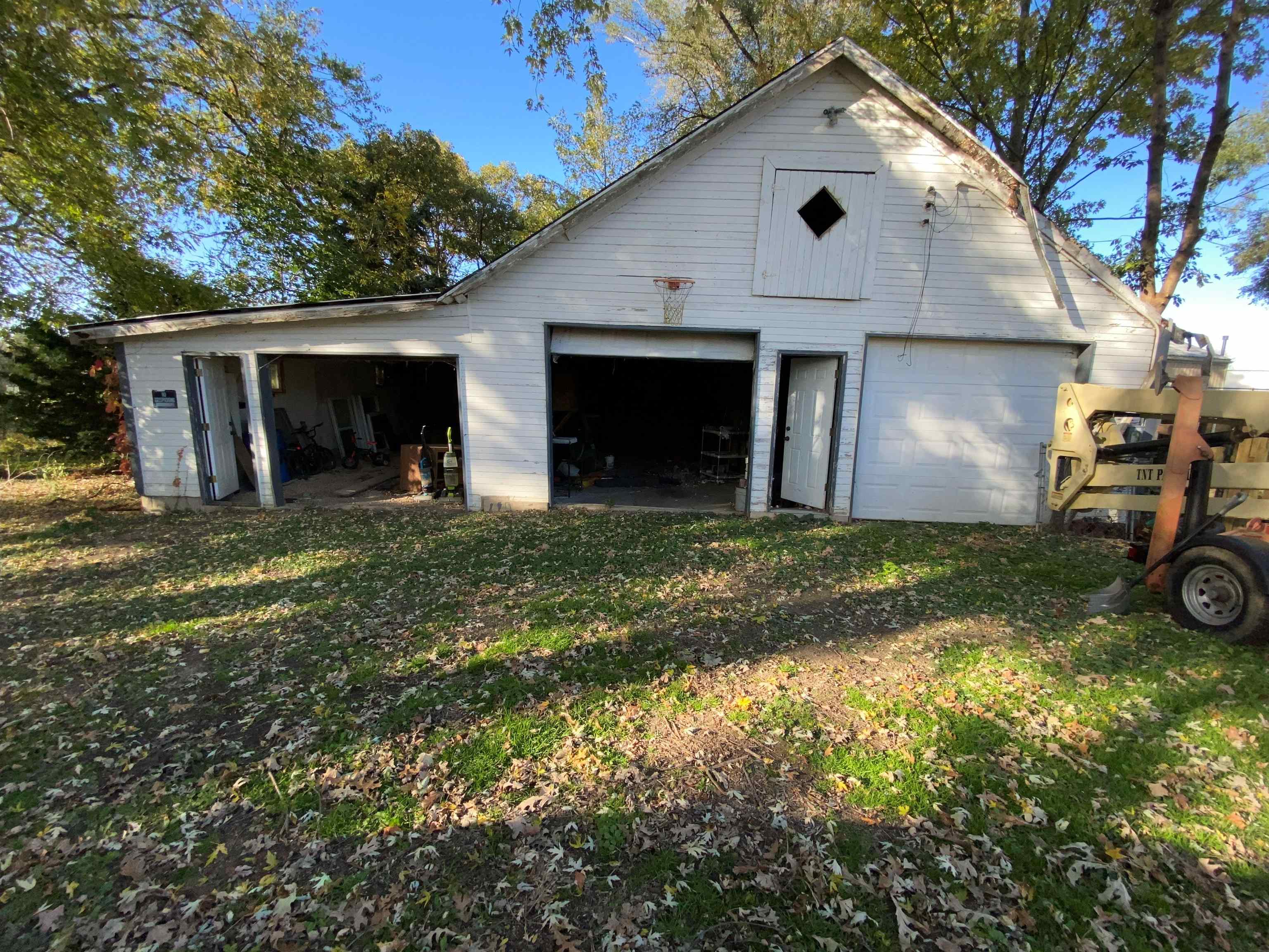 611 West Locust Street Belvidere, IL 61008 - Photo 21 of 39 a front view of a house with a yard and garage