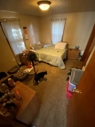 a bathroom with a toilet and a mirror