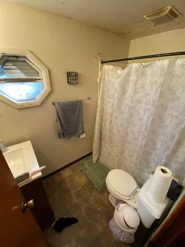 a room with furniture and a flat screen tv