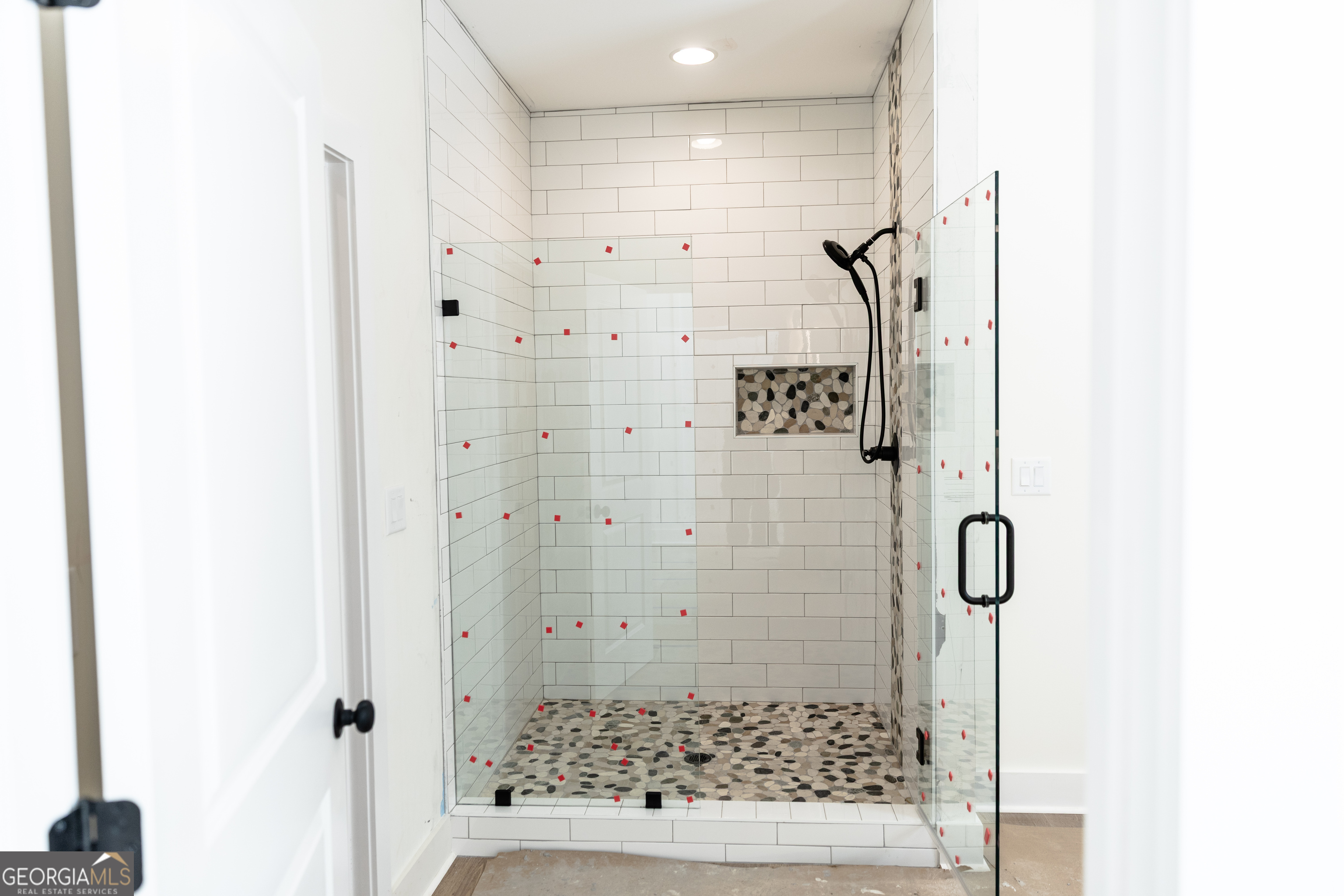 632 Campbell Road Covington, GA 30014 - Photo 22 of 60 a bathroom with a glass shower