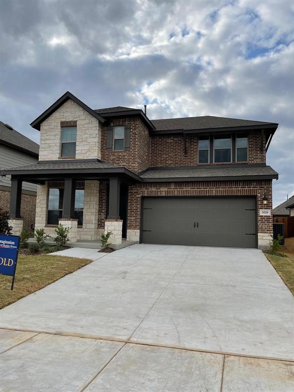 5529 Blue Point Lane Garland, TX 75043 - Photo 1 of 15 a front view of a house with yard and parking