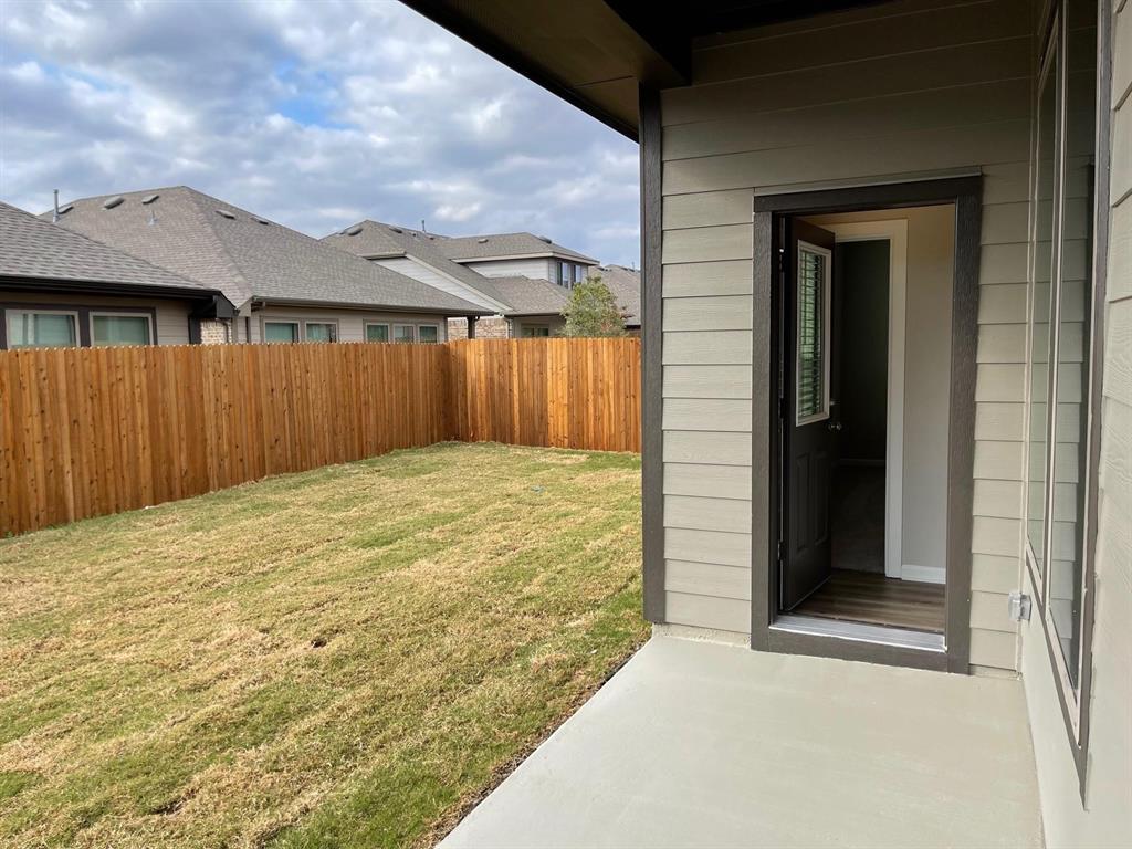 5529 Blue Point Lane Garland, TX 75043 - Photo 11 of 15 a view of backyard with a small cabin