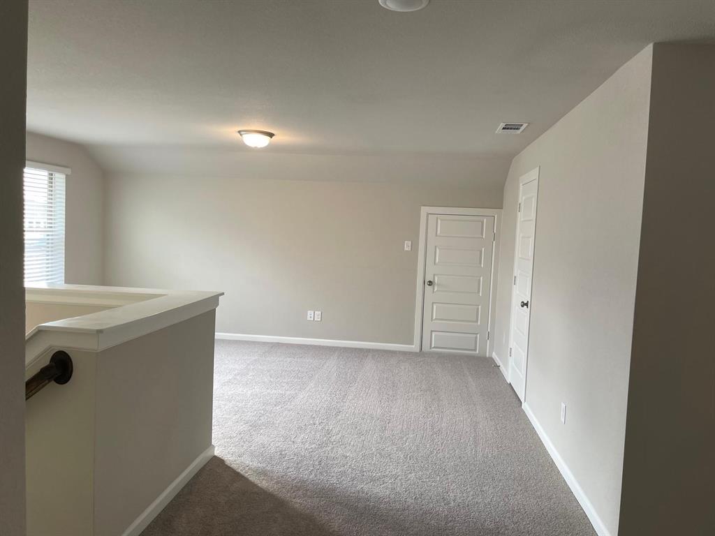 5529 Blue Point Lane Garland, TX 75043 - Photo 12 of 15 a view of an empty room with windows and cabinet
