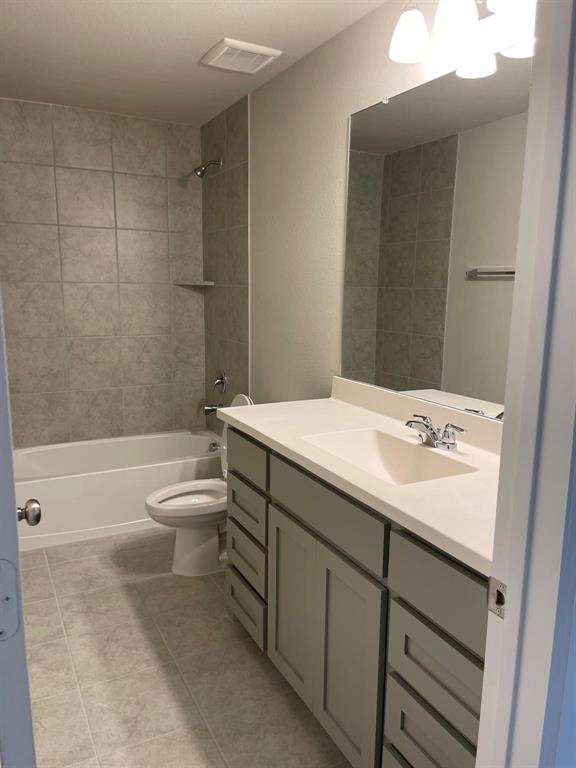 5529 Blue Point Lane Garland, TX 75043 - Photo 15 of 15 a bathroom with a sink a toilet and shower