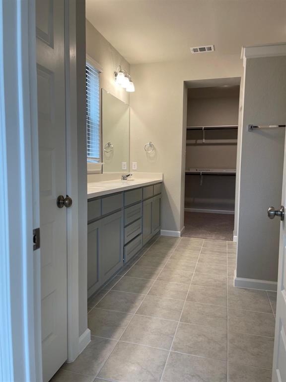 5529 Blue Point Lane Garland, TX 75043 - Photo 10 of 15 a bathroom with a sink and a mirror