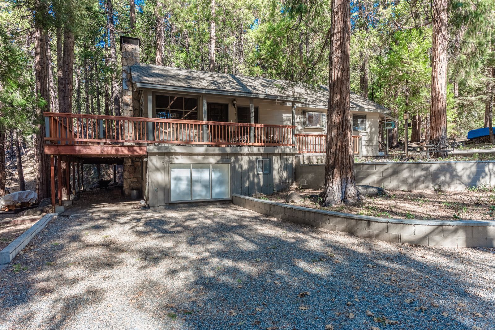 55180 Daryll Road Idyllwild, CA 92549 - Photo 5 of 7 a front view of a house with a garden