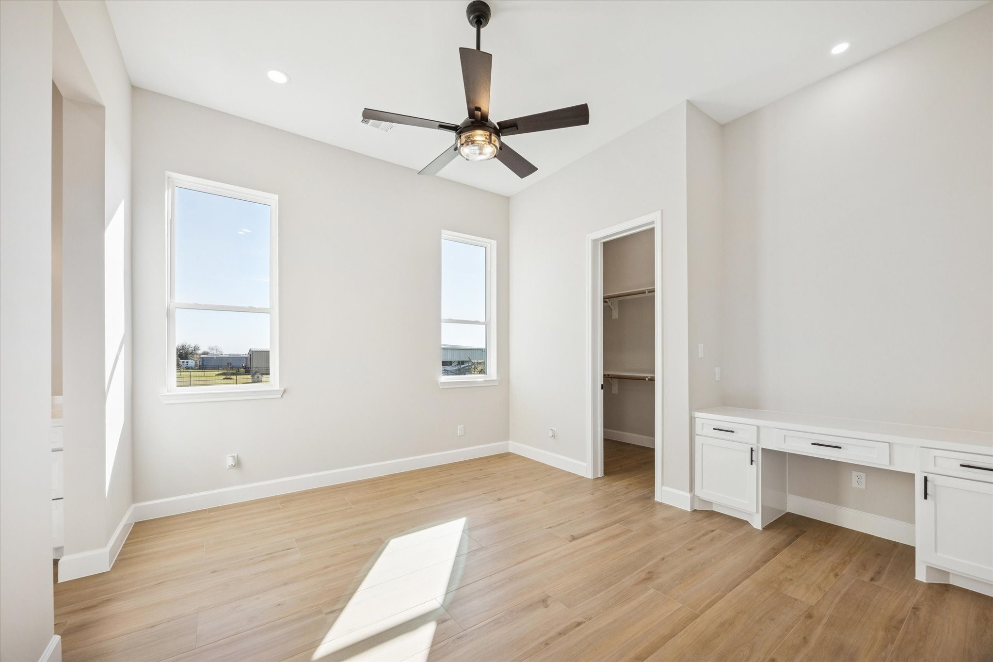 27645 Spring Hill Road Hempstead, TX 77445 - Photo 23 of 32 a view of an empty room with wooden floor and a window