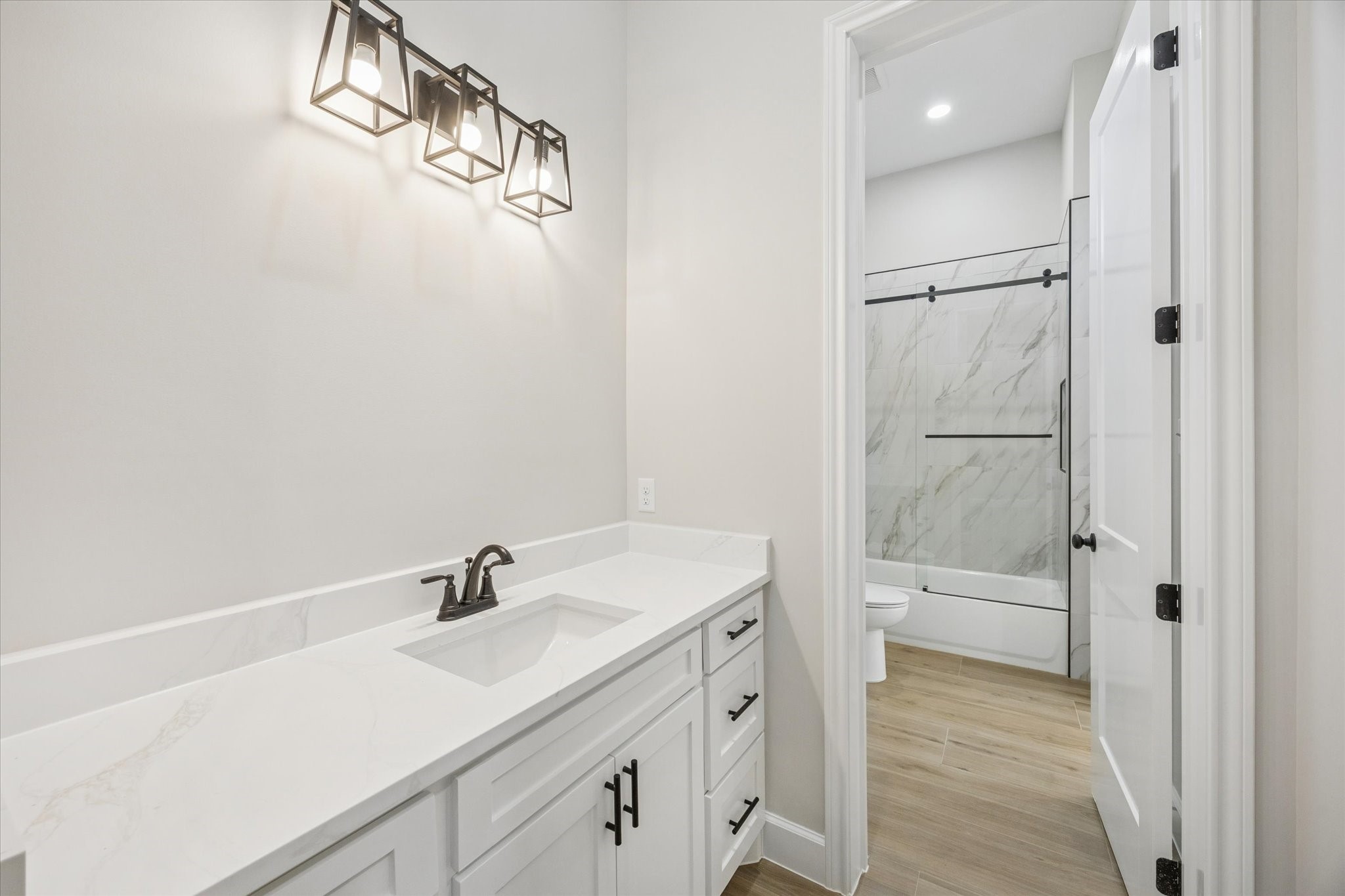 27645 Spring Hill Road Hempstead, TX 77445 - Photo 25 of 32 a bathroom with a sink a toilet and shower