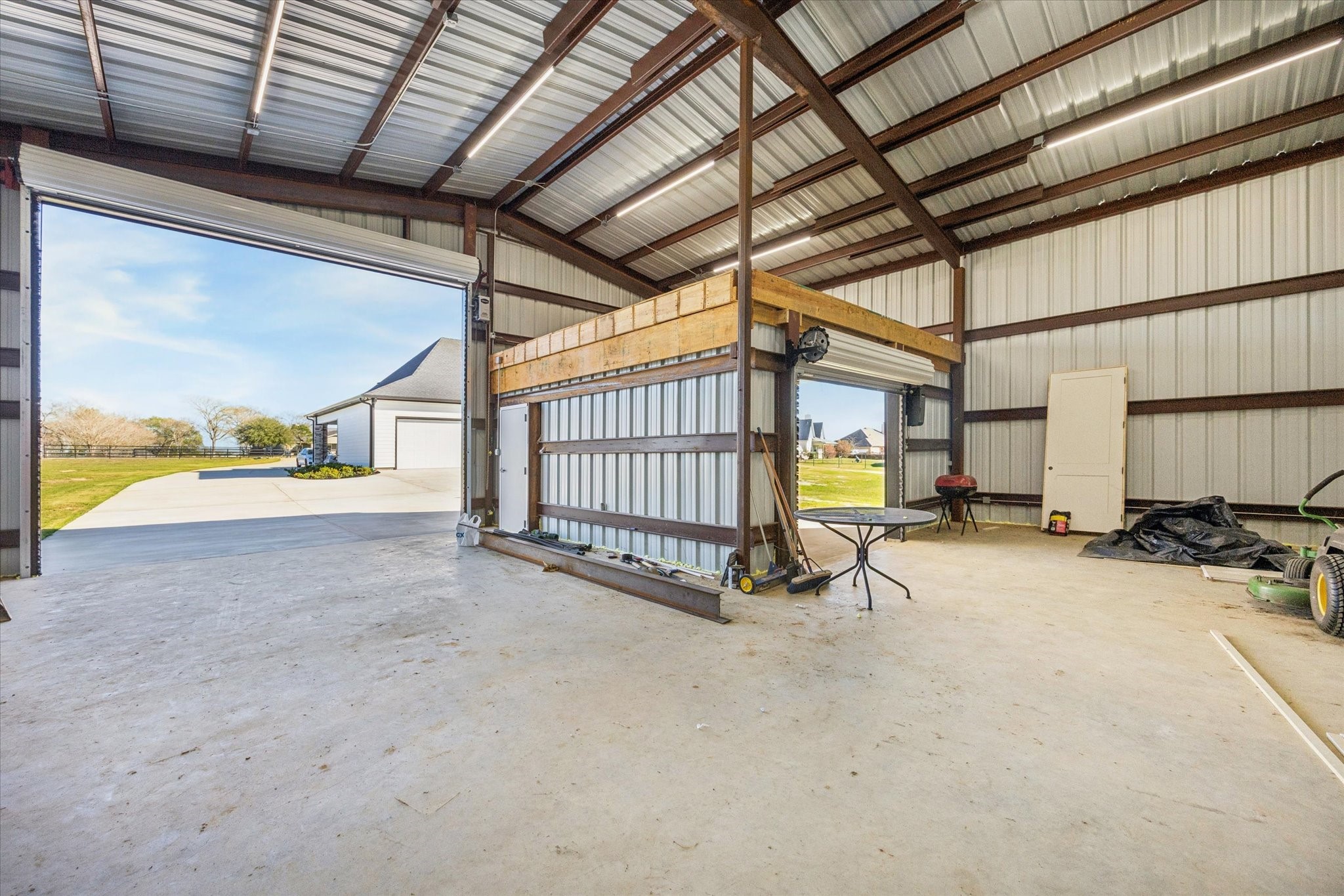27645 Spring Hill Road Hempstead, TX 77445 - Photo 31 of 32 a view of a house with a garage