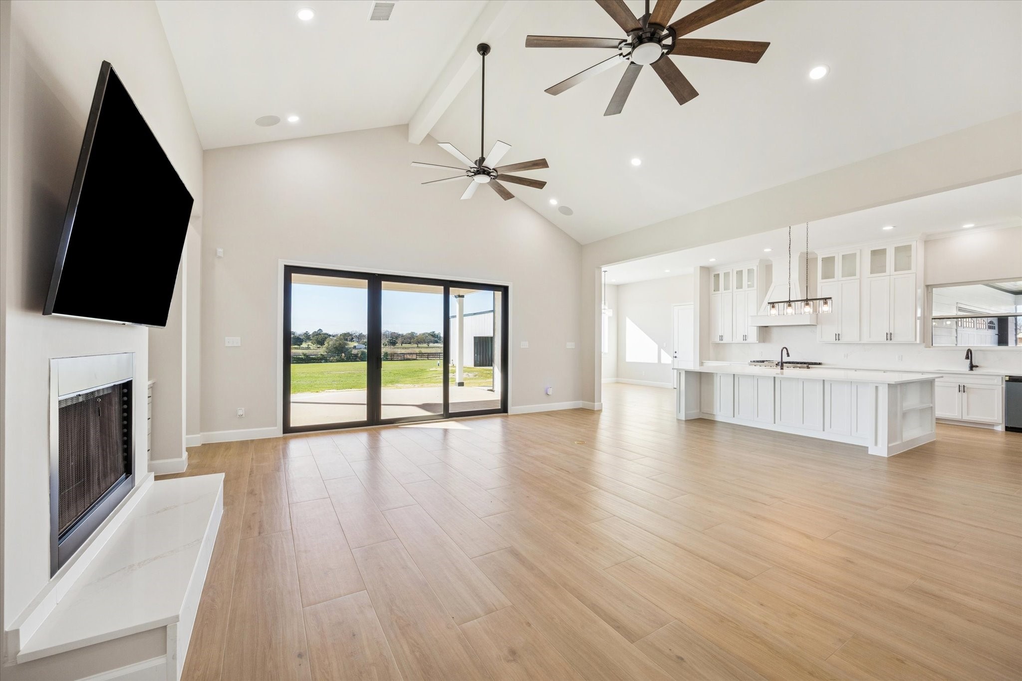 27645 Spring Hill Road Hempstead, TX 77445 - Photo 7 of 32 a view of an empty room with a fireplace and a window