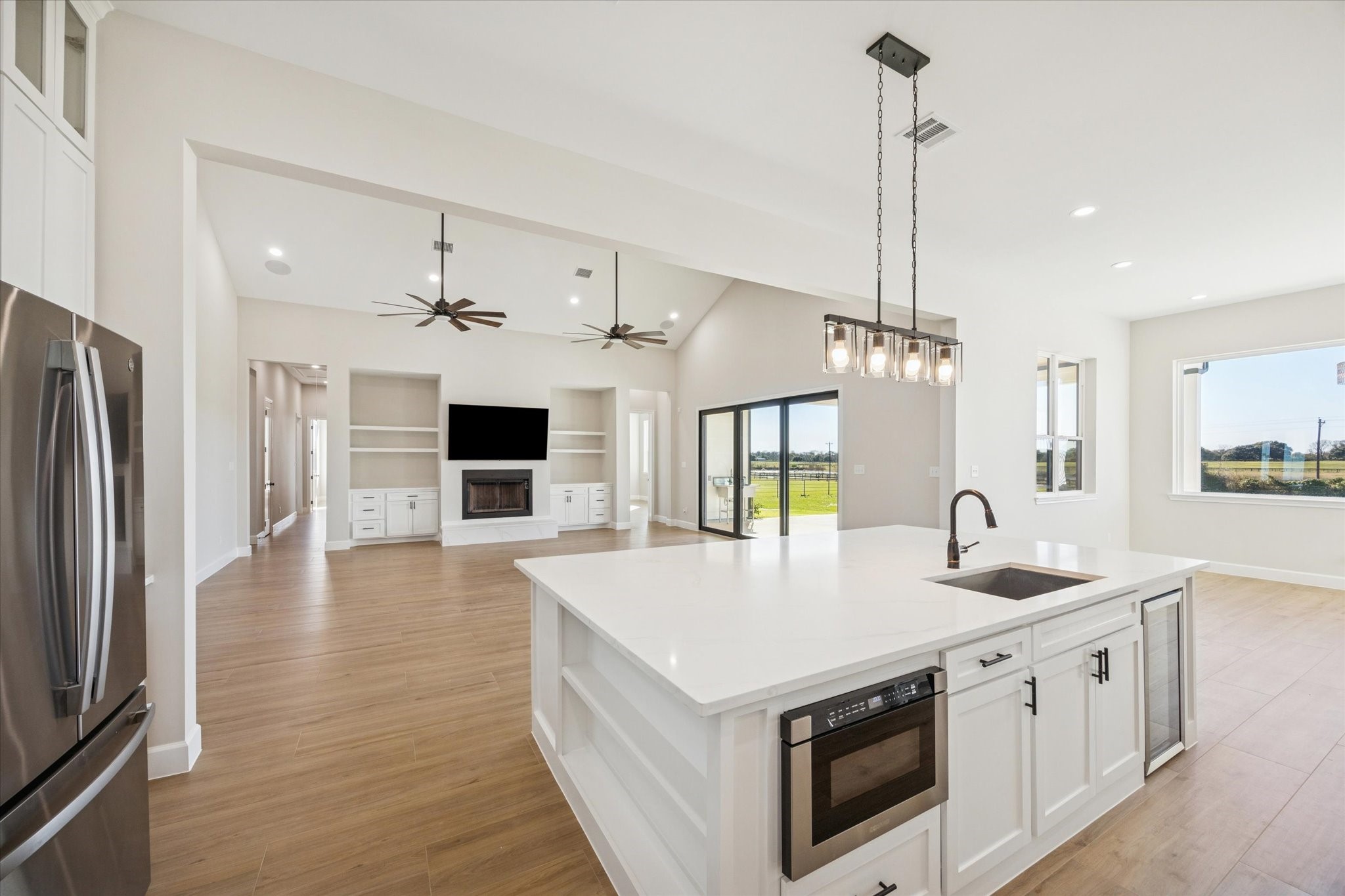 27645 Spring Hill Road Hempstead, TX 77445 - Photo 10 of 32 a kitchen with stainless steel appliances granite countertop a sink a stove and a refrigerator