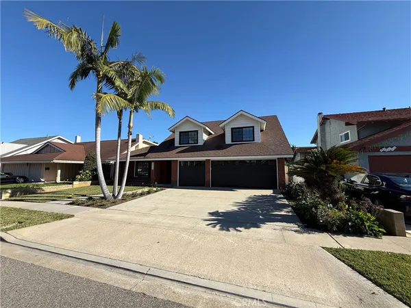 a front view of a house with yard