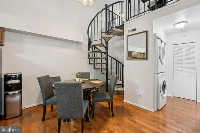 a view of a room with furniture wooden floor and window