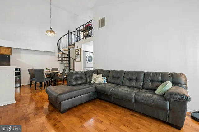 a living room with furniture and white walls