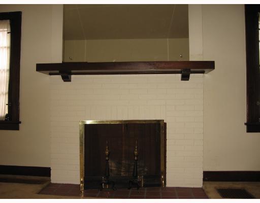 154 Hawthorne Road Pittsburgh, PA 15209 - Photo 2 of 7 Living Room. Old world charm shows in details like the brick log burning fireplace and original woodwork.