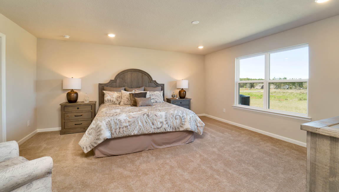 30 Fannin Street Freeport, FL 32439 - Photo 12 of 16 a bedroom with a bed and a large window