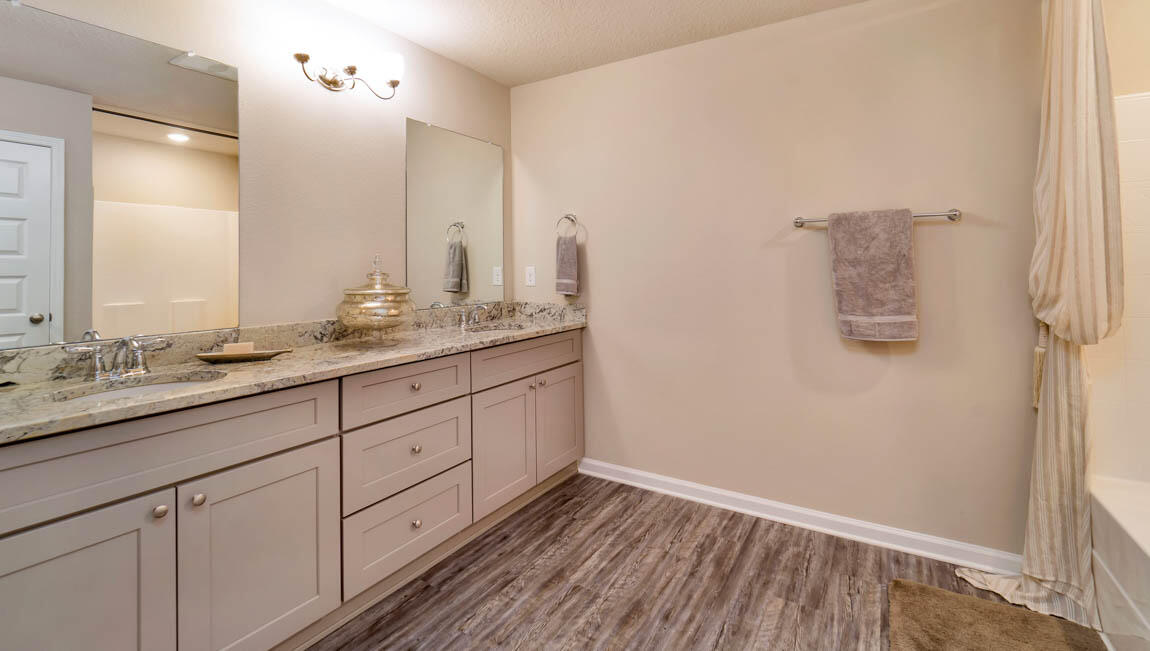 30 Fannin Street Freeport, FL 32439 - Photo 14 of 16 a bathroom with a granite countertop sink and a mirror
