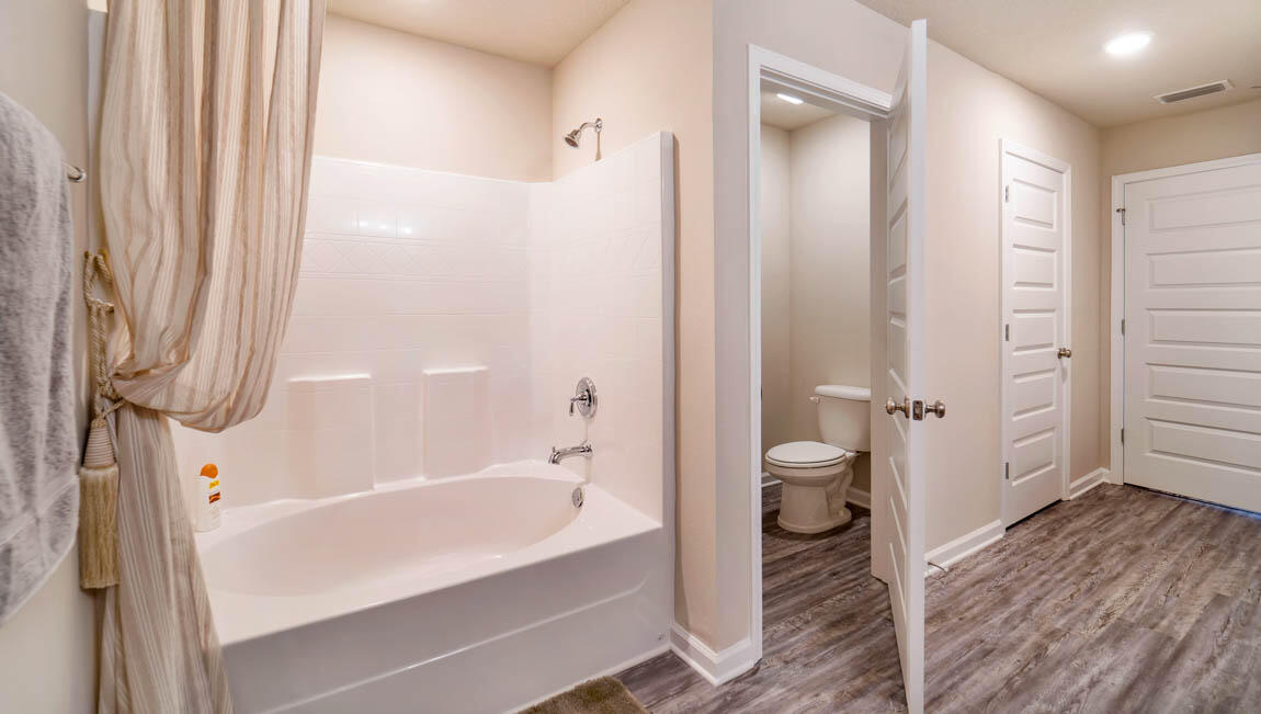 30 Fannin Street Freeport, FL 32439 - Photo 15 of 16 a bathroom with a bathtub and a shower