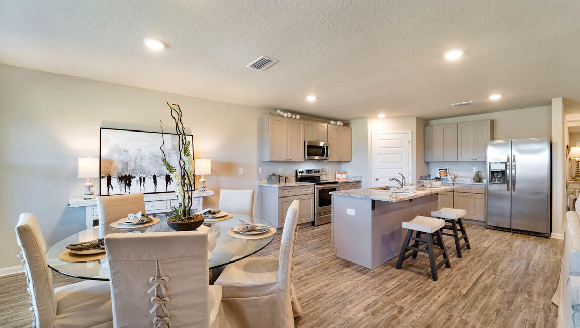 30 Fannin Street Freeport, FL 32439 - Photo 4 of 16 a large kitchen with a table and chairs