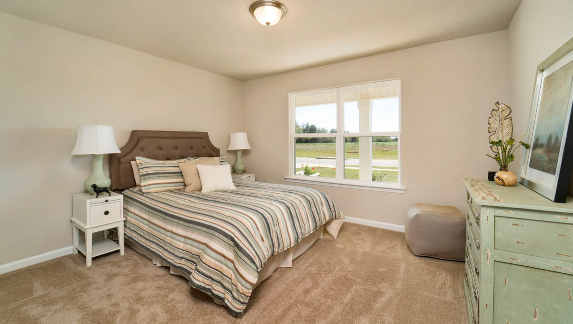 30 Fannin Street Freeport, FL 32439 - Photo 8 of 16 a bedroom with a bed and a window