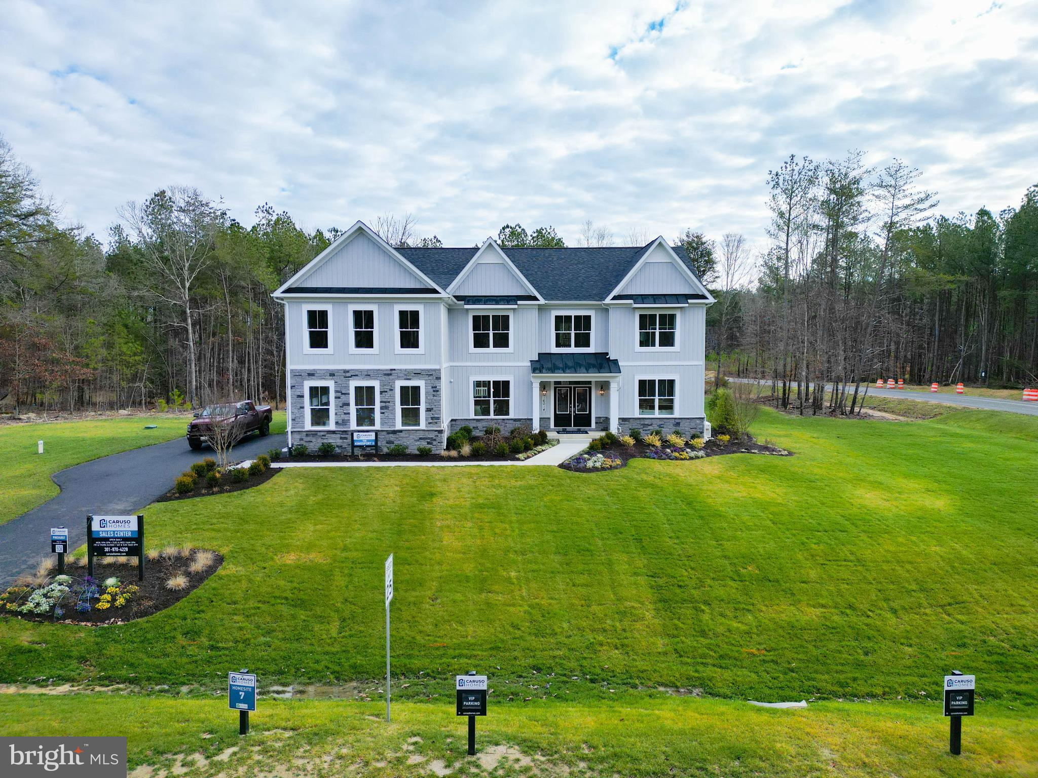 4996 Ilchester Road Ellicott City, MD 21043 - Photo 25 of 74 a front view of a house with garden