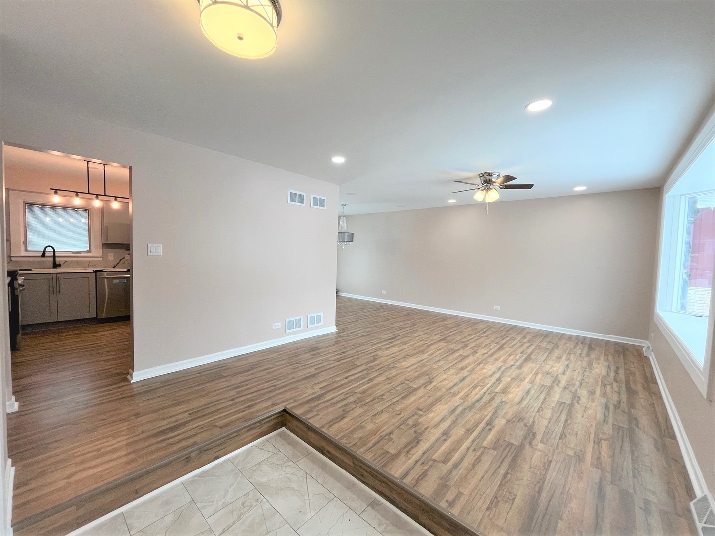 525 South Cherry Street Itasca, IL 60143 - Photo 3 of 20 wooden floor in an empty room with a window
