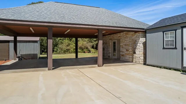 an aerial view of a house with a outdoor space