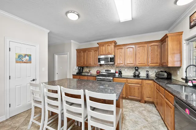 a bedroom with a bed and a flat tv screen
