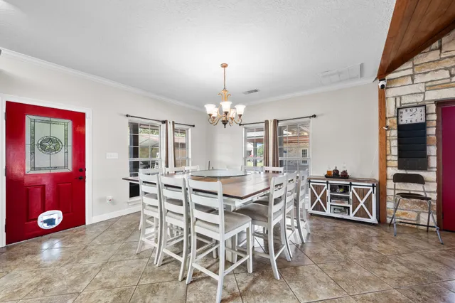 a bathroom with a granite countertop toilet sink and mirror