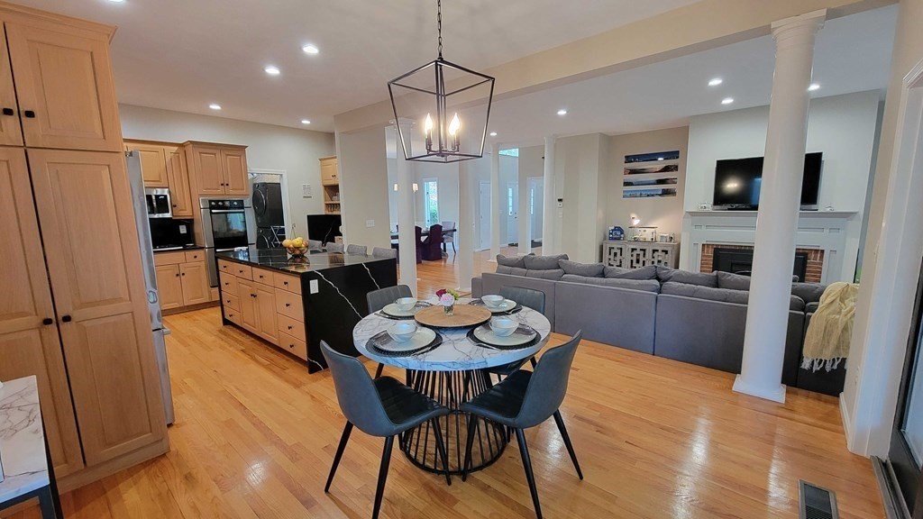 104 Channing Road Concord, MA 01742 - Photo 11 of 36 a large kitchen with a table and chairs