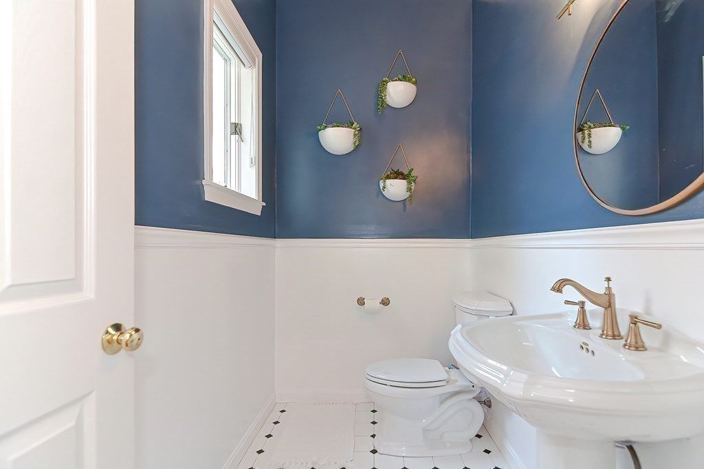 104 Channing Road Concord, MA 01742 - Photo 22 of 36 a bathroom with a sink mirror and toilet