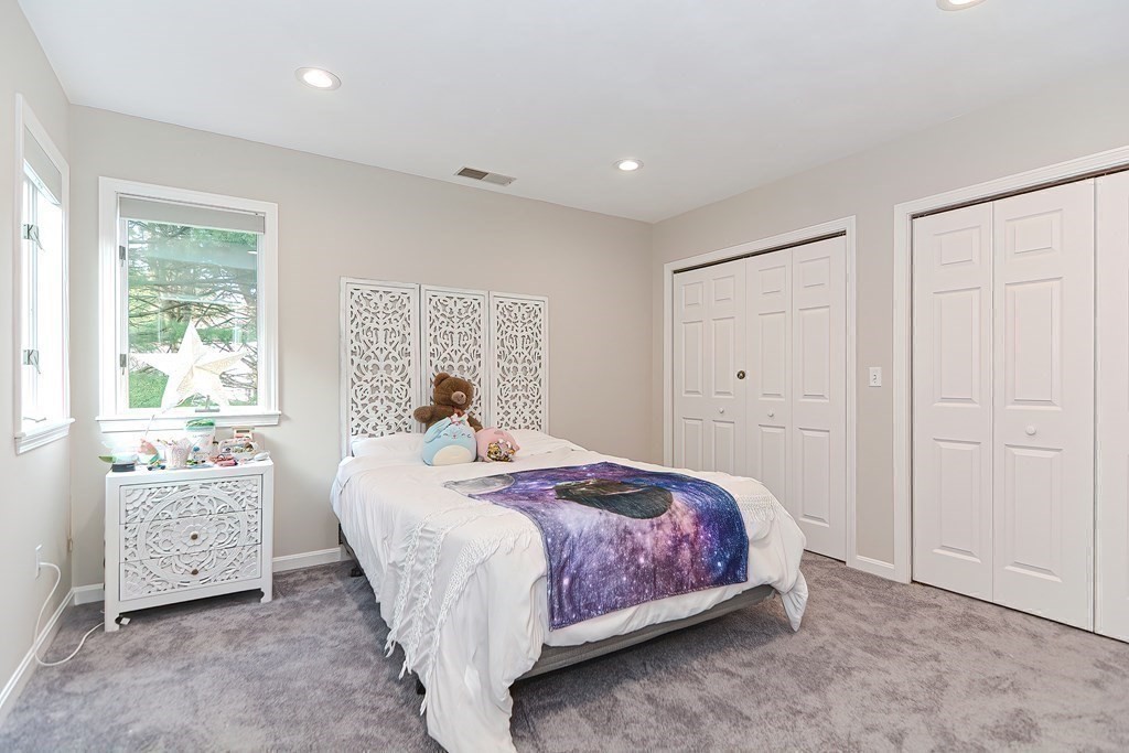 104 Channing Road Concord, MA 01742 - Photo 26 of 36 a bedroom with a bed and a window