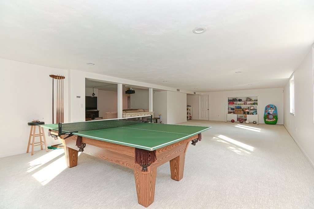 104 Channing Road Concord, MA 01742 - Photo 30 of 36 a living room with furniture pool table and windows