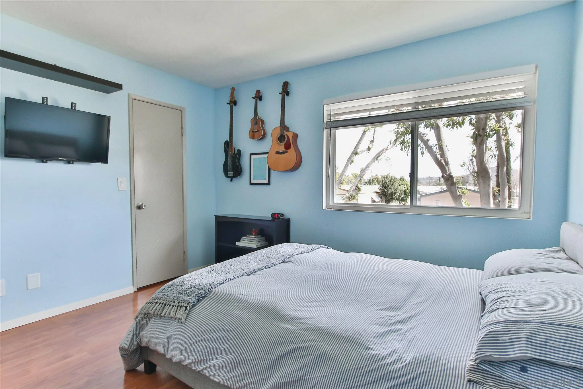 2502 Wanek Road, Unit B Escondido, CA 92027 - Photo 10 of 29 a bedroom with a large bed and a window