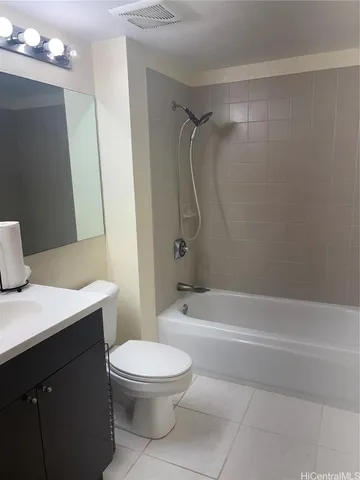 a bathroom with a toilet a sink and shower