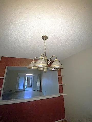 a view of a hallway to a bedroom