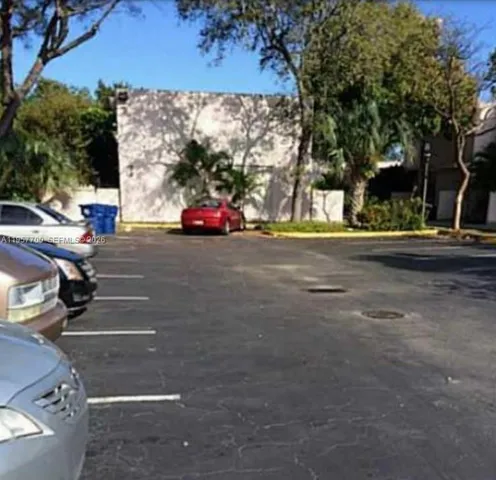 a view of street with parked cars