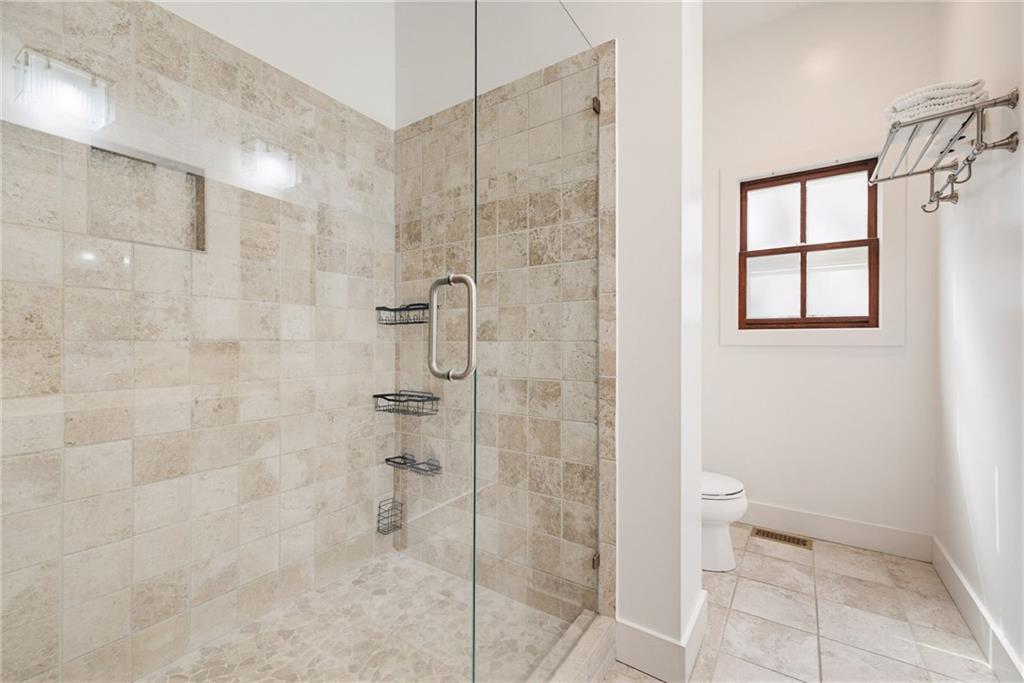 245 Forkner Drive Decatur, GA 30030 - Photo 17 of 31 a bathroom with a shower and a toilet