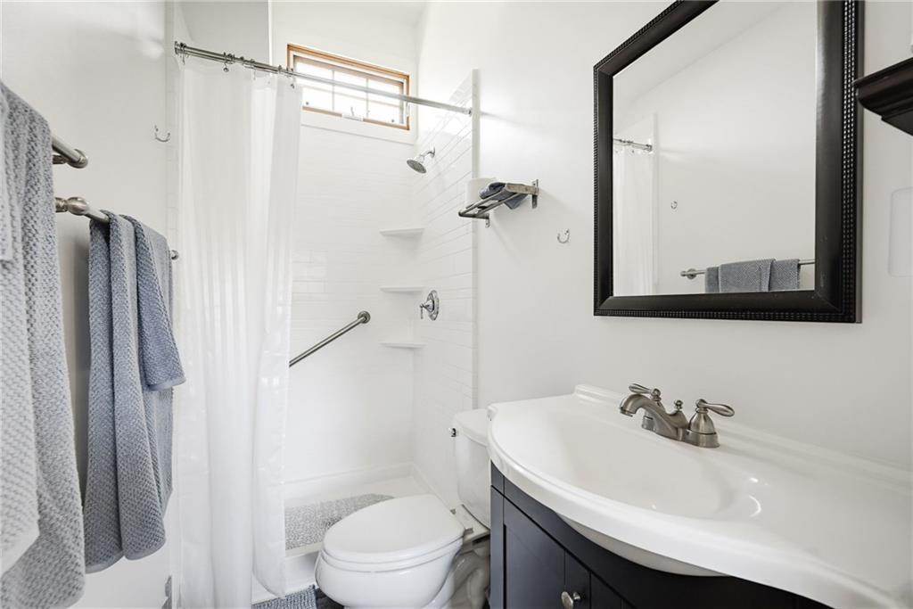 245 Forkner Drive Decatur, GA 30030 - Photo 29 of 31 a bathroom with a sink toilet and shower