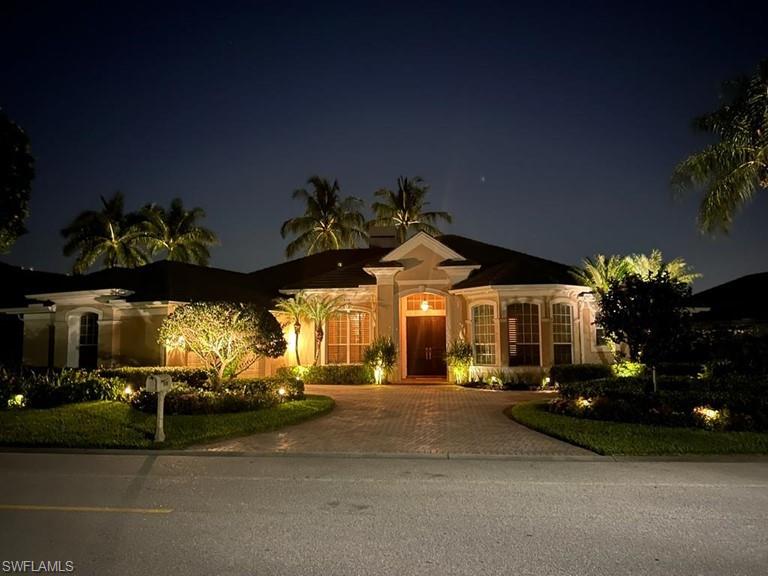 a view of a street with cars