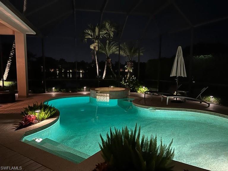938 Spanish Moss Trail Naples, FL 34108 - Photo 7 of 11 a view of a table and chairs in patio